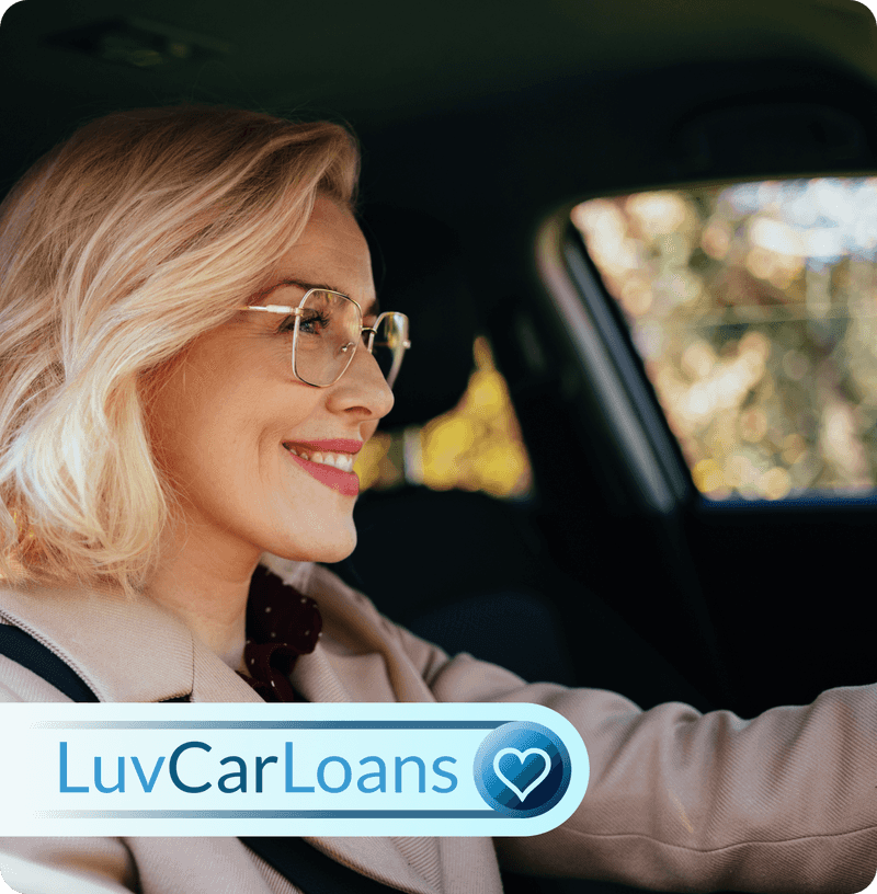 Luv Car Loans logo over a happy woman driving her new car