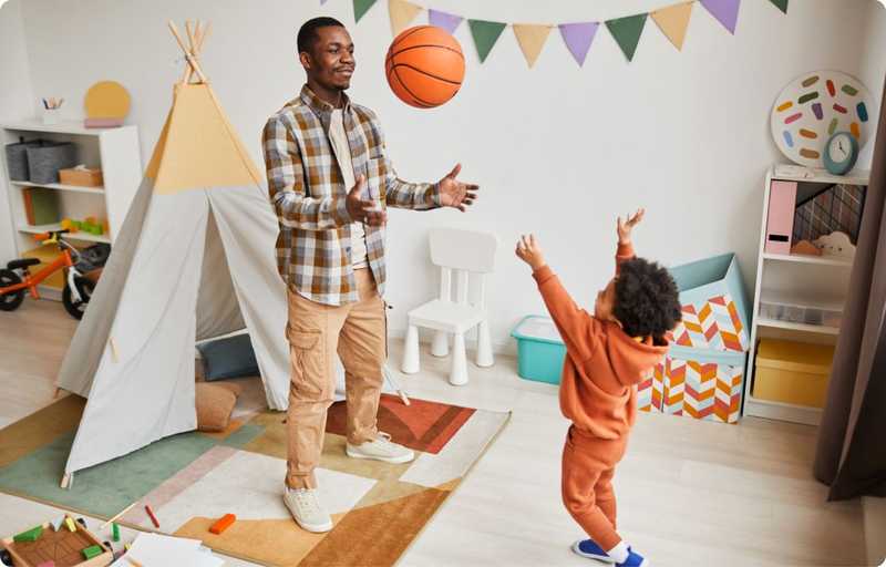 Man playing basketball with son