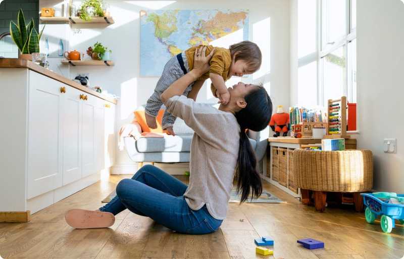 Woman holding up baby