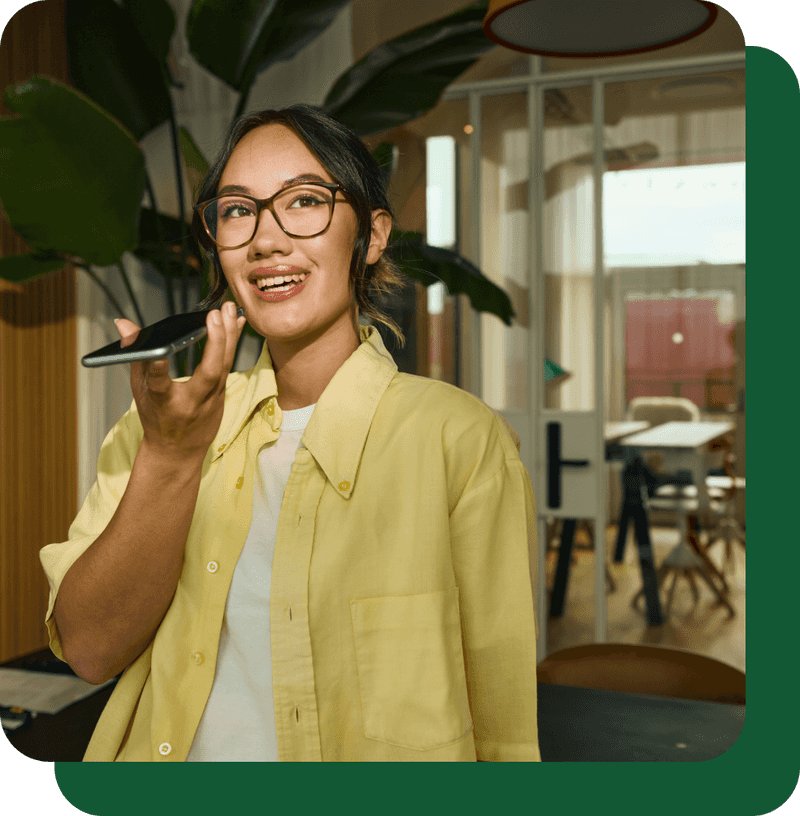Woman talking to her phone at an office